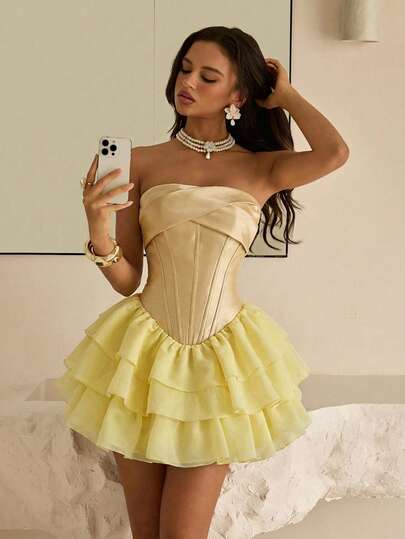 Lovelzi Elegant Pale Yellow Strapless Dress With A Glossy Satin Bodice And Twisted Boning. Features A Flattering Low-Waisted Design In Organza Fabric With A Multi-Layered Princess Tiered Skirt. Adjustable Back With Tie Detail. Suitable For Dates, Bachelorette Parties, Weddings, Back-To-School Celebrations, And All Formal Occasions. Also Suitable For Women's Prom Dresses.