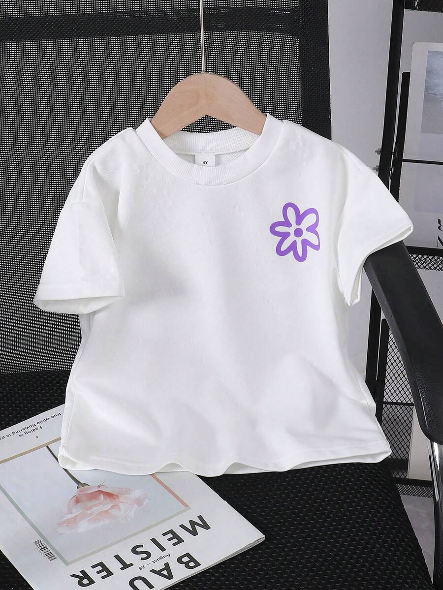 Genkimix Kids Áo thun ngắn tay cổ tròn dáng rộng cho bé gái, nền xanh nhạt in hoa vàng, thiết kế thoải mái và dễ thương, thích hợp cho bé gái chơi đùa hàng ngày vào mùa hè, dạo chơi trong vườn, dã ngoại gia đình và các dịp khác. - trắng - Xem 1