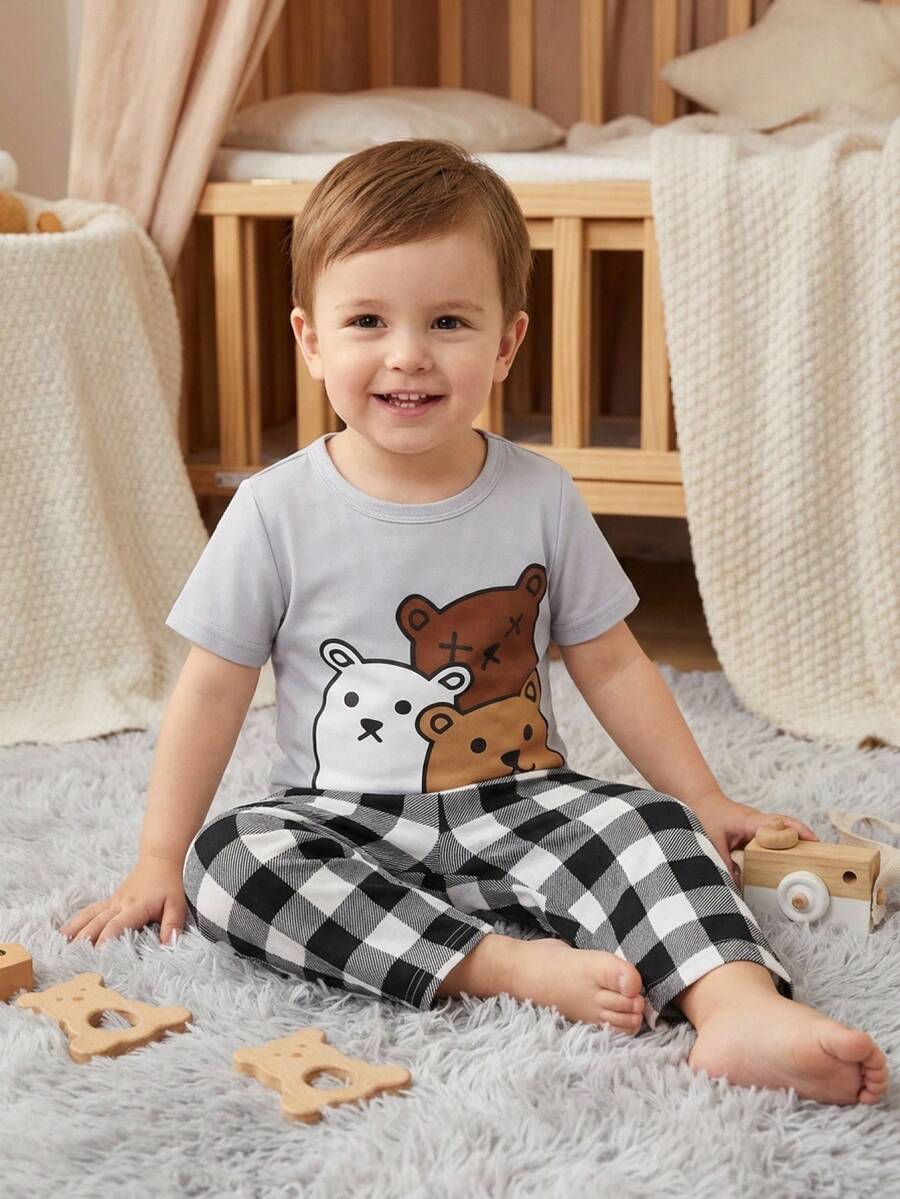 SHEIN Baby Boy Cute Cartoon Penguin Print Round Neck Short Sleeve T-Shirt And Plaid Pattern Loose Casual Pajama Pants 2pcs Set
