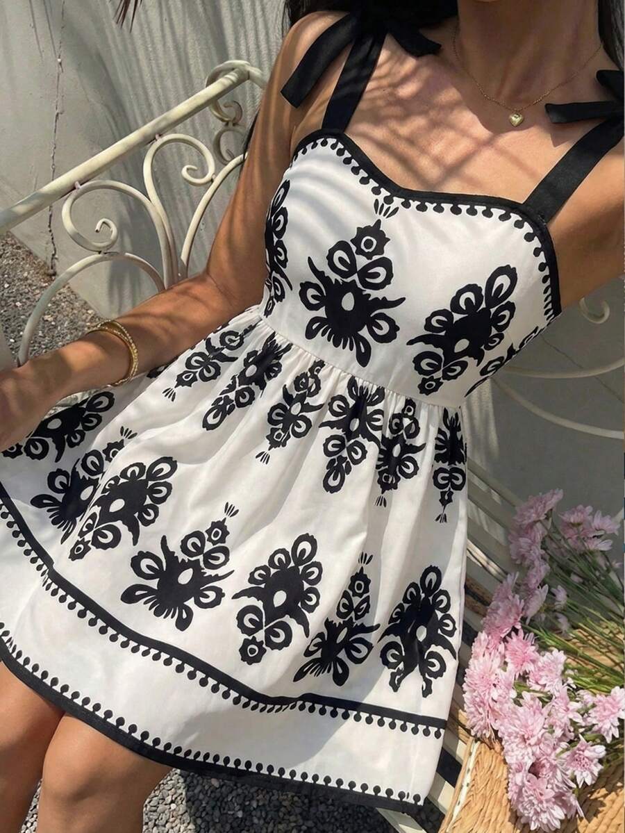 Đầm hồng thanh lịch cho bé gái tuổi teen, họa tiết hoa hồng, dây mảnh, vai bèo nhún và nơ, dáng chữ A, thích hợp cho kỳ nghỉ, đi học, dã ngoại, mùa xuân/hè. - màu đen - Xem 1