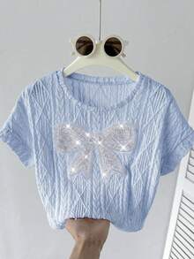 SHEIN Camiseta de niña preadolescente de manga raglán suelta, cuello redondo, texturizada, con bordado y decoración de lazo de cuentas, de color azul claro para primavera/verano - Celeste - Ver 5