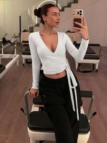 Abrilcols Áo crop top tay dài cổ chữ V tập yoga thể thao màu hồng mềm mại, độ đàn hồi cao, thời trang, giản dị, thiết kế thanh lịch, phù hợp cho mọi đối tượng dành cho phụ nữ, mùa xuân và mùa thu - trắng - Xem 1