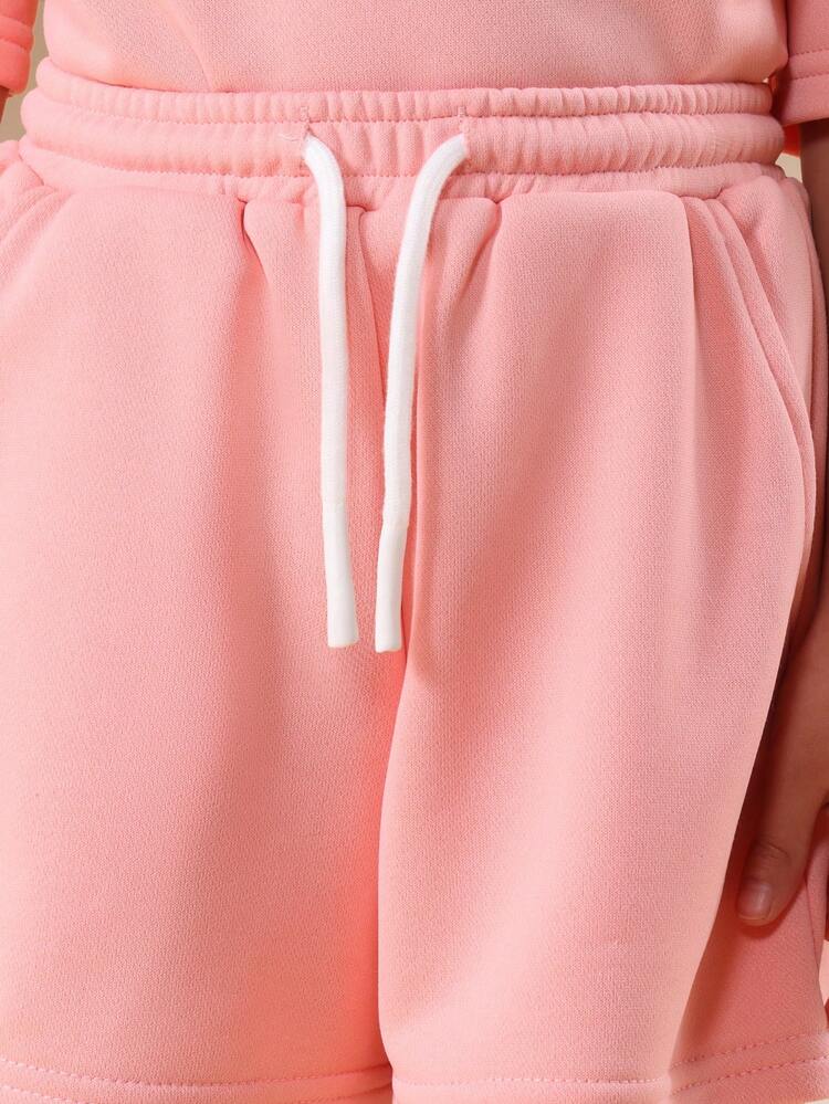 Dziewczęcy różowy, oversize'owy T-shirt i pasujące do niego spodenki, letni komplet z nadrukiem księżyca z kryształkami, okrągłym dekoltem i krótkimi rękawami