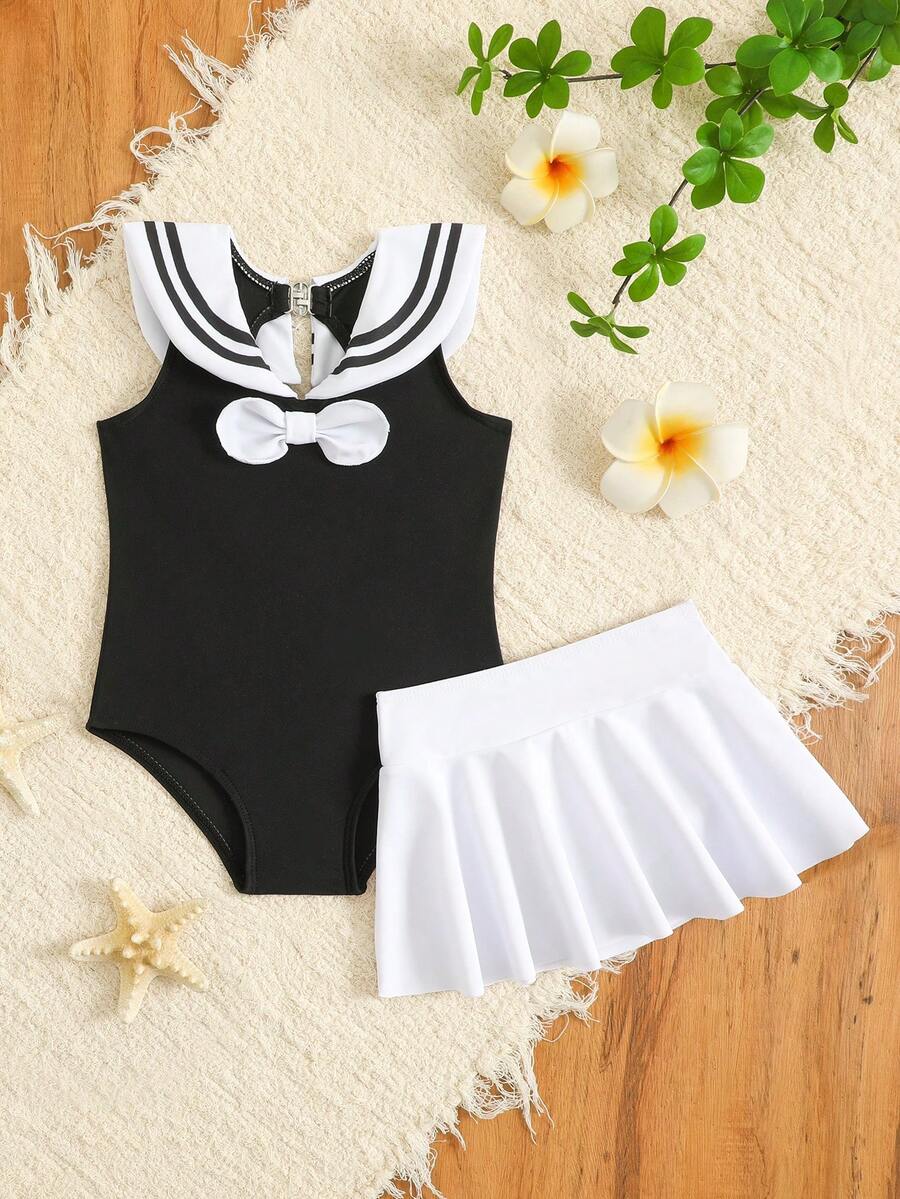 SHEIN Bộ áo tắm liền thân và váy cho bé gái, phối họa tiết nơ, thích hợp cho kỳ nghỉ biển, tiệc bể bơi, tiệc bãi biển. - Đen và trắng - Xem 1