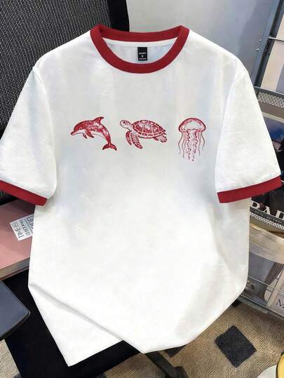 Manfinity Joysei Camiseta de manga corta de cuello redondo para hombre con estampado de animales marinos y ribete de contraste para uso casual diario