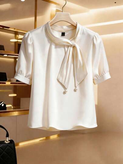 GlowEve CURVE Plus Size Women's Bow Satin Shirt Women's Summer New Temperament Loose White Pullover Chiffon Shirt Top Bow Pearl Summer New Top Plus-Size Women's Irregular Neckline Tie Bow Short-Sleeved Top With A Glossy Finish, Elegant And Going-Out Style, Perfect For Business Casual Summer Women's Outfits. Elegant Blouses French Romantic Retro Elegant Commuting Faux Shine On Summer Spring Wedding Guest Party