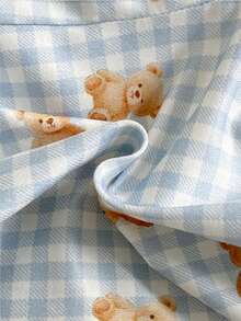 Bộ 2 món cho bé trai gồm áo thun cổ tròn in hình gấu ngồi dễ thương và quần in hình gấu kẻ caro xanh trắng, thoải mái và chống cháy. - Màu xanh lam - Xem 3