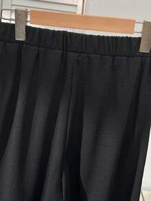 Bộ đồ thường ngày đa năng cho nữ tuổi teen, màu đen trắng, không tay cổ tròn, phối viền tương phản, gồm áo thun và quần ống rộng dệt kim. - Đen và trắng - Xem 4