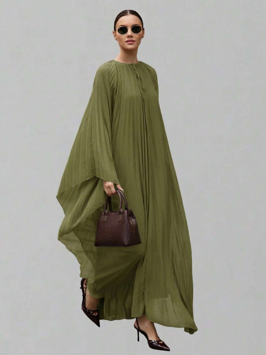 Ontre Đầm nữ màu xanh lá cây, chất liệu chiffon chống nhăn, thoải mái, dáng suông, cổ tròn, tay áo cánh dơi, chân váy xếp ly rộng, điểm nhấn là nơ hình giọt nước. Kiểu dáng hiện đại, năng động, phù hợp cho công sở, đi biển, thanh lịch cổ điển. Chất liệu chiffon cao cấp chống nhăn, thích hợp cho các kỳ nghỉ. - màu xanh lá - Xem 1