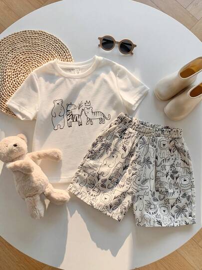 SHEIN 两件套男童休闲可爱卡通动物印花柔软针织圆领T恤和舒适纹理弹力腰带口袋短裤套装，适合春、夏、秋季日常穿着、运动、郊游、上学、聚会、节日、演出和摄影。