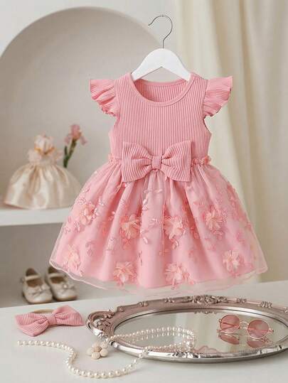 Baby Girl's Solid Color Ruffle Sleeve A-Line Mesh Floral Dress With Matching Bow Headband, Spring/Summer. The Waist Bow And Headband Complement Each Other, And The Floral Mesh Hem Adds A Delicate And Adorable Touch. The Classic A-Line Silhouette Suits Various Baby Body Types. This Outfit Will Make Your Little Princess The Center Of Attention During Daily Outings, And Is An Ideal Fashionable Choice For Moms.