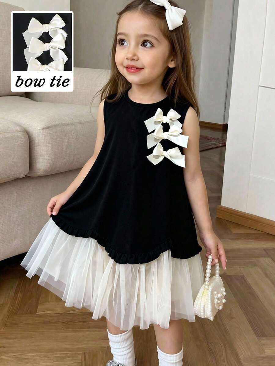 SHEIN Elladie kids 女童春夏新款简约优雅连衣裙，浅桃色3D蝴蝶结缎带，黑色梭织面料拼接浅桃色网纱不对称下摆无袖连衣裙，适合年轻女孩，简约优雅的女士风格，适合日常、上学、外出、度假等春夏穿着。儿童连衣裙，蓬蓬裙，女童连衣裙，黑白儿童连衣裙，蝴蝶结连衣裙，黑白女童连衣裙，幼儿女童夏季服装。柔软连衣裙。 - 黑色 - 查看 1