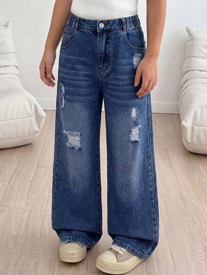 SHEIN Quần jeans ống đứng dáng rộng cho bé gái, thiết kế tối giản, thoải mái và đa năng mới, mài rách bất đối xứng, cạp chun có khóa kéo, phù hợp cho mặc hàng ngày và đi nghỉ mát, màu xanh denim trung bình.