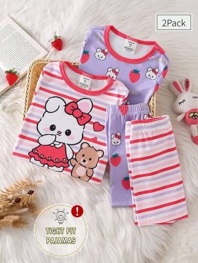 Bộ đồ ngủ 4 món cho bé gái, gồm áo và quần ngắn, họa tiết trái cây và thỏ hoạt hình, chất liệu vải mềm mại, kẻ sọc, tay ngắn và ôm sát.