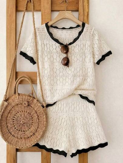 SHEIN Franclia 新款度假装扮，女士夏季套装，白色镂空针织两件套——短袖露脐上衣，黑色撞色扇形边饰，搭配同款短裤，复古女性魅力与俏皮休闲风格。
