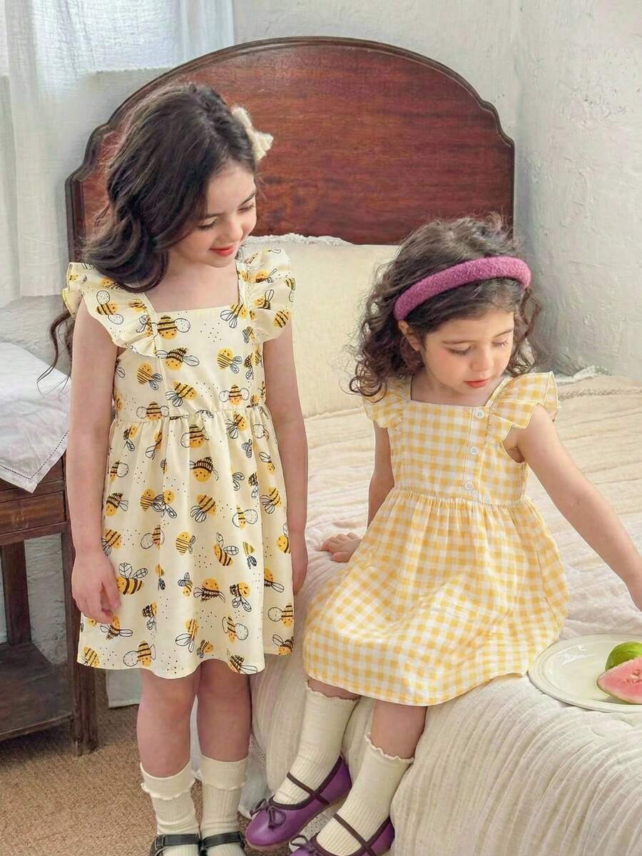 SHEIN Set de 2 vestidos de verano sin mangas con botones y estampado floral para niñas bebé - Amarillo - Ver 1