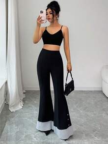 Elenzga 这款女士打底裤采用柔软舒适的牛奶丝面料，全弹力腰带设计，穿着舒适贴身，尽显曼妙身姿。喇叭裤腿、条纹裤脚和金属纽扣点缀，更添优雅纤细气质。适合外出、旅行和聚会等各种场合，是女士衣橱必备单品。 - 黑色 - 查看 5