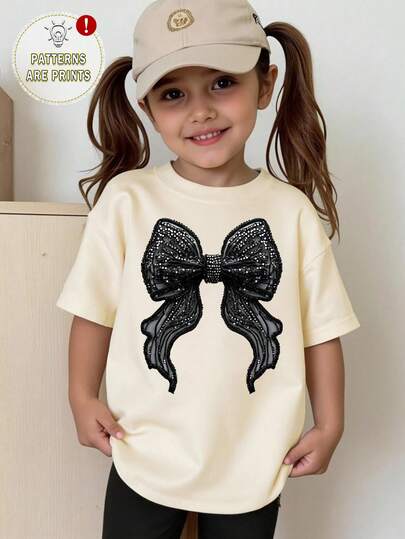 SHEIN 女童休闲仿水钻蝴蝶结印花短袖T恤，创意蝴蝶印花黑色蝴蝶结短袖上衣，百搭春夏款