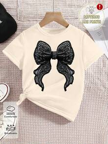 SHEIN Girls' Casual Faux Rhinestone Bow Print Short Sleeve T-Shirt, Creative Butterfly Print Black Bow Short Sleeve Top, Versatile Spring/Summer - Apricot - View 3
