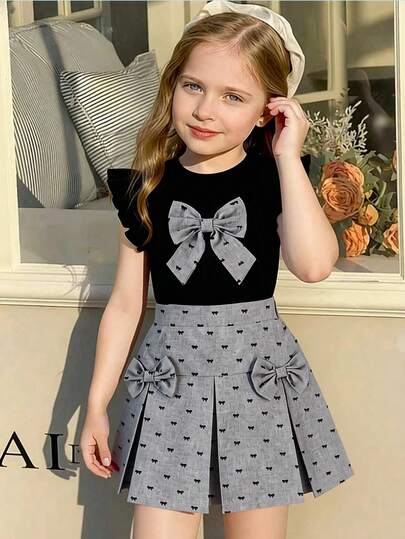 Set de 2 piezas: Camiseta de manga acampanada con cuello redondo y estampado jacquard negro para niñas pequeñas, con decoración de lazo gris, y falda elástica de cintura gris tejida, adecuado para primavera/verano, uso diario, exterior, viajes, fiesta