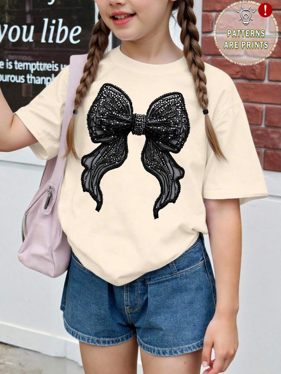 SHEIN Girls' Casual Faux Rhinestone Bow Print Short Sleeve T-Shirt, Creative Butterfly Print Black Bow Short Sleeve Top, Versatile Spring/Summer - Apricot - View 1