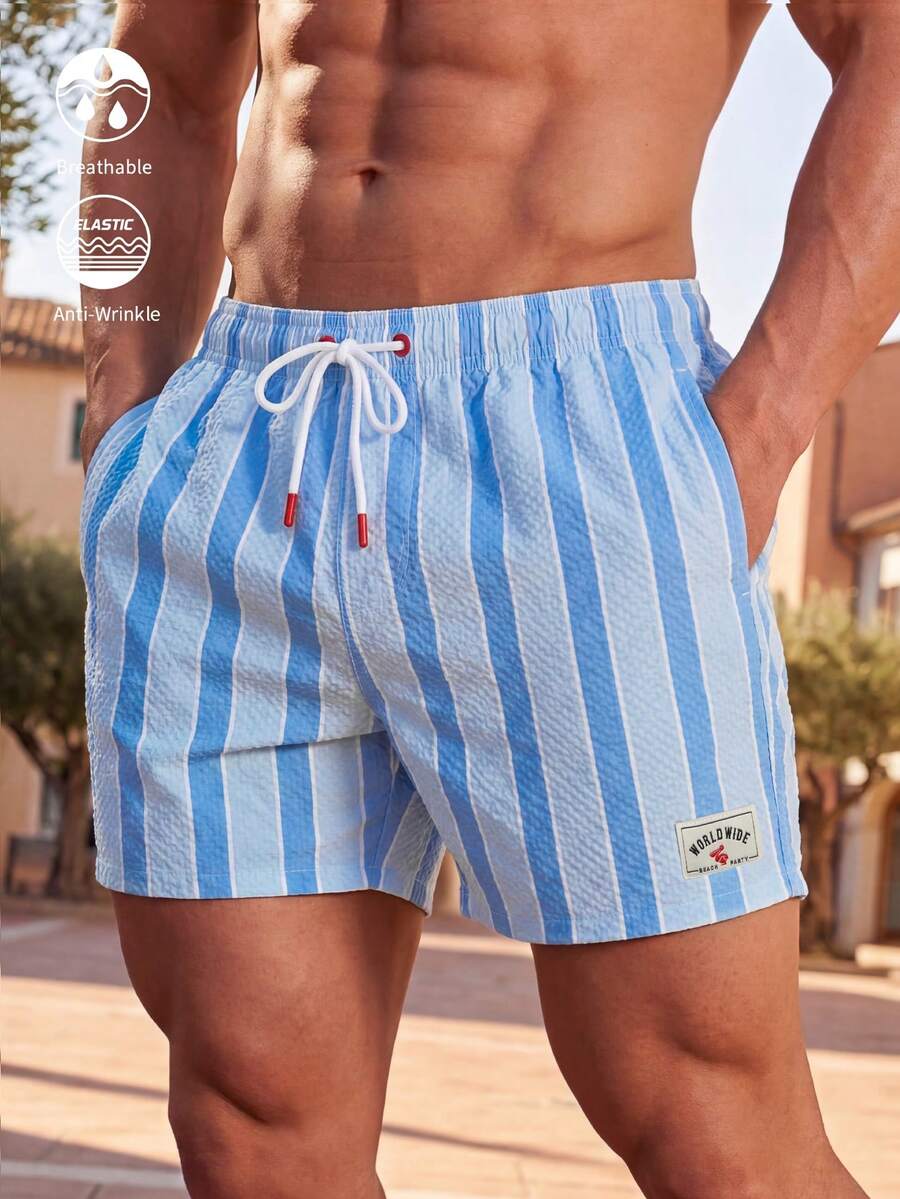 Manfinity VDAYZ Quần short đi biển nam có dây rút, họa tiết chữ và sọc. - Màu xanh nhạt - Xem 1