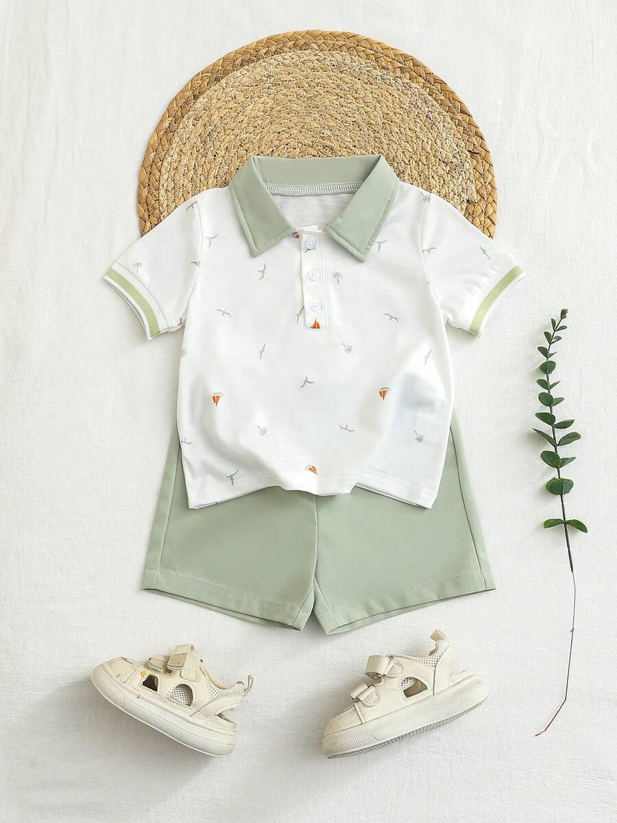 SHEIN 这款幼儿男童夏季休闲两件套,包含一件棕榈树和小船印花翻领Polo衫和一条松紧腰短裤,时尚舒适,适合6个月至3岁的男童,是日常穿着、户外活动和返校的理想之选。 - 綠色 - 查看 1