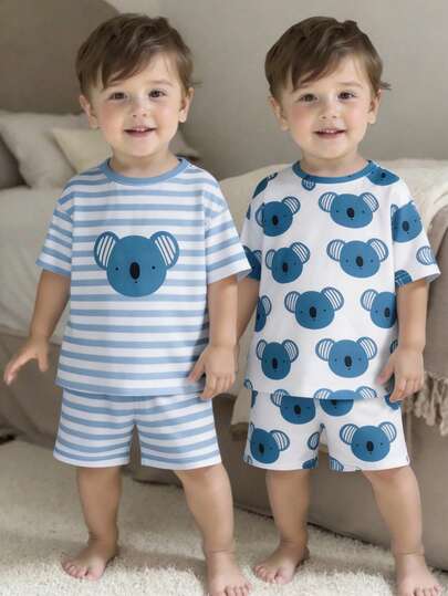 SHEIN Bộ đồ ngủ tay ngắn 4 món cho bé trai, gồm áo cổ tròn và quần, với họa tiết động vật và sọc. Chất vải mềm mại và thoải mái, phù hợp cho trẻ mặc hàng ngày.
