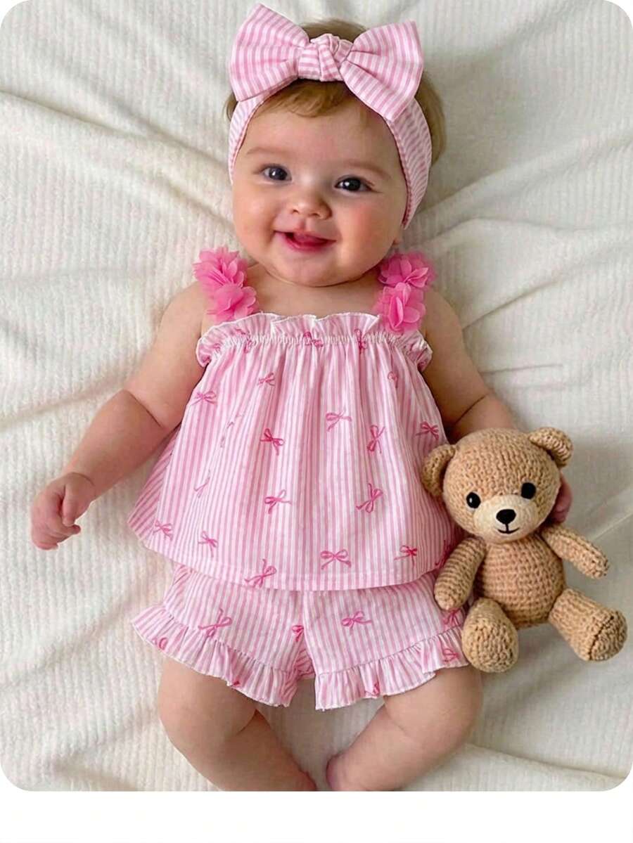 SHEIN Conjunto de camiseta de tirantes y pantalones cortos a rayas rosas y blancas con lazo, estilo casual y lindo para bebé niña de vacaciones - Rosa - Ver 1