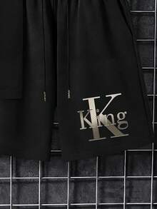 Manfinity Homme Bộ đồ nam thường ngày gồm áo thun ngắn tay in chữ và quần short. - màu đen - Xem 5