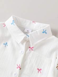 SHEIN Playful Pals Young Girls Graphic Print Bow Tie Basic White Short Sleeve Shirt, Squishy Textured Button-Up Shirt, Suitable For Back To School, Holidays, Summer Clothes, Travel, Party Wear, Travel And Spring/Summer Seasons, Picnic, Vacay Vibes, Summer Outfit, Can Be Used As A Gift For Outings, Daily Wear, Sports, Parties, Birthday Gifts, Graduation Dress, Elegant Outfit - White - View 5
