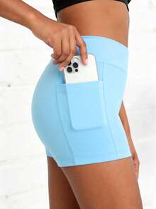 Quần short nữ màu trơn dáng casual dành cho bé gái tuổi teen, thiết kế cạp chéo và có túi, được làm từ chất liệu co giãn 4 chiều giúp tôn dáng và thoải mái vận động, hoàn hảo cho đạp xe, chạy bộ, tập gym và mặc hàng ngày năng động. - Màu xanh lam - Xem 3