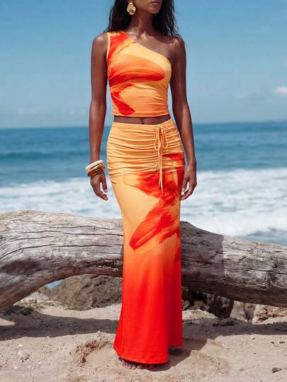 Trelyra 女士新款橙色印花两件套：不对称褶皱单肩上衣搭配饰有大百合花的长款鱼尾裙，甜美、性感、迷人，海滩度假风