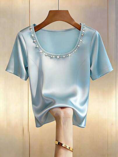 GlowEve Camiseta azul casual, elegante y versátil de mujer con cuello redondo, sin mangas, cintura ajustada, bajo con abertura y cuentas, de punto lujoso y brillante
