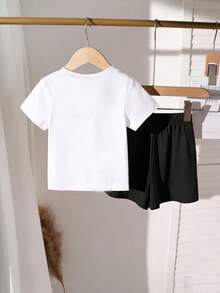 2 pezzi/set Maglietta a maniche corte con scollo tondo e stampa farfalla nera minimalista e pantaloncini larghi casual per ragazze giovani, motivo carino e alla moda adatto per primavera ed estate, completo casual per ragazze, set di maglietta e pantaloncini per bambine - Bianco - Visualizzare 2