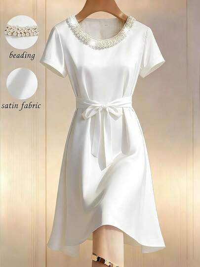 Franclia Đầm nữ màu sâm panh mới, chất liệu bóng mượt, cổ tròn, đính ngọc trai, thắt nơ ở eo, thích hợp cho các dịp thường ngày, đi làm, dự tiệc, trà chiều, tay ngắn, dáng dài ngang gối.