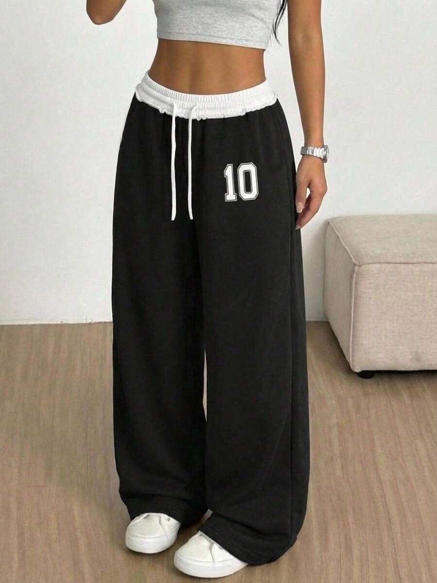 SHEIN Pantalones de chándal casuales holgados de pierna ancha con estampado de número y cintura con cordón de color bloque para niña preadolescente - Negro - Ver 1