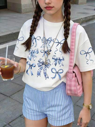 Set de 2 piezas para niñas preadolescentes: Camiseta de manga corta de cuello redondo suelta y cómoda, y shorts. Estampado de lazo lindo combinado con shorts sueltos a rayas. Vibes de verano, adecuado para atuendos de primavera y verano.