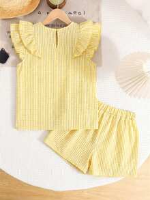 SHEIN LMoss Kids Set de 2 piezas de blusa con cuello redondo y volantes y pantalones casuales y cómodos de color amarillo para niñas preadolescentes - Amarillo - Ver 5
