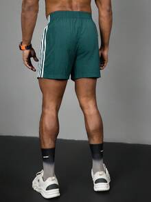 Acti Log Pantalones cortos deportivos casuales con rayas de contraste para hombres, pantalones cortos de gimnasio, pantalones cortos verde azulado, pantalones cortos deportivos con rayas, pantalones cortos deportivos duraderos con rayas verdes para hombres con bolsillos, ligeros - Verde - Ver 2