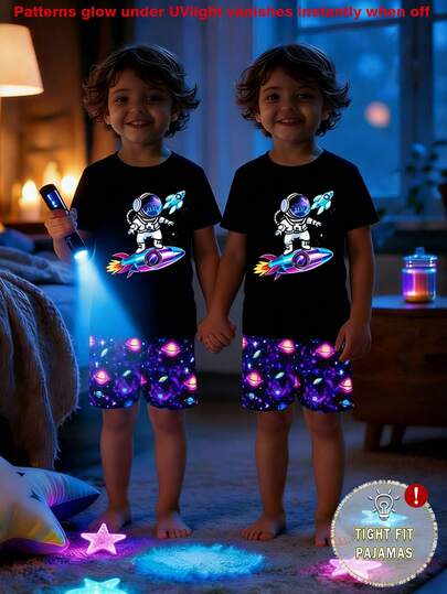 4件套男童夜光宇航员火箭印花针织紧身睡衣，包括圆领上衣和印花短裤，适合居家穿着，带有紫外线灯，可发出夜光效果，是送给孩子的绝佳礼物。