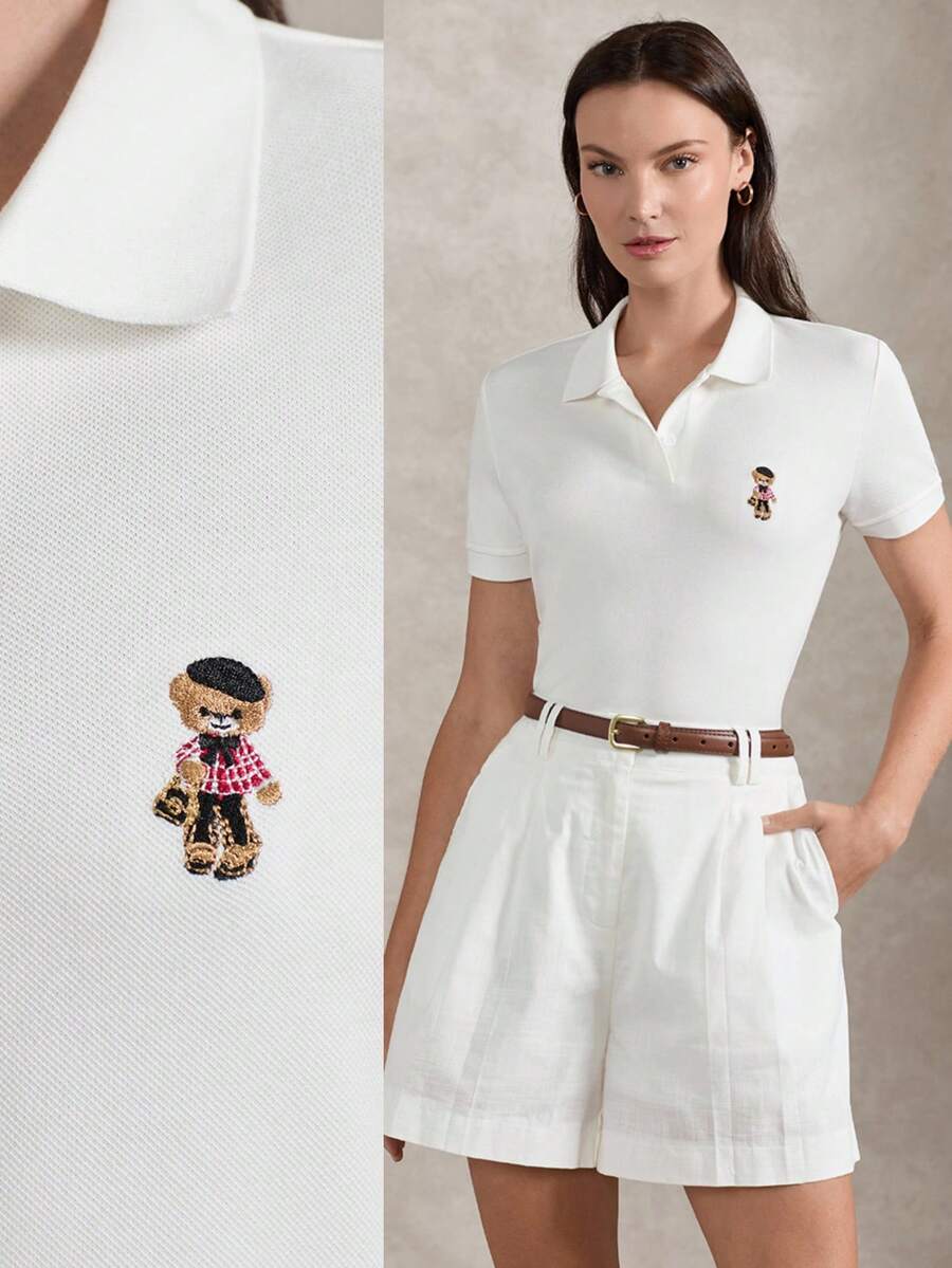 Briarwyn 夏季女士纯棉经典白色Polo衫，饰有可爱小熊刺绣，短袖休闲上衣，适合日常穿着。这款女士休闲上衣饰有可爱的小熊图案，是夏季上衣、白色Polo衫、女士Polo衫、女士工作衬衫、女士休闲装、夏季女士衬衫、白色上衣、毕业典礼服装等的理想之选。 - 白色 - 查看 1