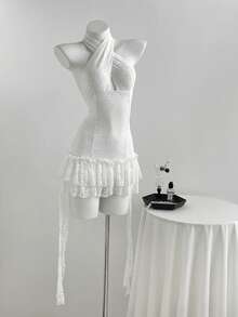 Elamini 女士蕾丝不对称下摆无袖露背吊带迷你连衣裙，性感时尚，适合春、夏、秋季穿着。 - 白色 - 查看 1