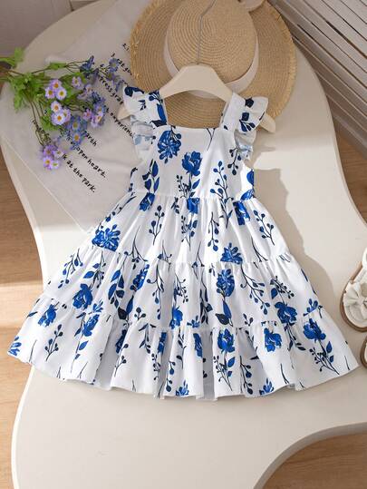 SHEIN Vestido largo de halter de estilo jardín de viento de polvo azul medio para niña joven, de tela tejida, tipo A-line. Con su suave tono de polvo azul medio y un diseño de halter delicado, la falda está cubierta con pequeños patrones de flores blancas, como flores en florecimiento en primavera. El borde con volantes del tirante es ingenioso y lindo, agregando dulzura y capas al conjunto. Adecuado para playa de vacaciones, salidas, ocio en casa, bodas, cumpleaños, actuaciones de fiestas y otras ocasiones