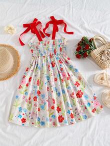 这是一条适合小女孩的连衣裙，优雅的浅黄色碎花连衣裙，饰有花朵和小兔子图案。它采用细肩带设计，裙摆饰有荷叶边，并点缀着蝴蝶结。A字廓形，非常适合度假或上学穿着，是春夏两季女孩们的绝佳选择——一条真正可爱的印花连衣裙。 - 紅色 - 查看 2