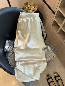 GlowEve Embossed Embossed Satin Fabric Lace-Up Elastic Waist Loose Women Casual Pants - Apricot - View 1