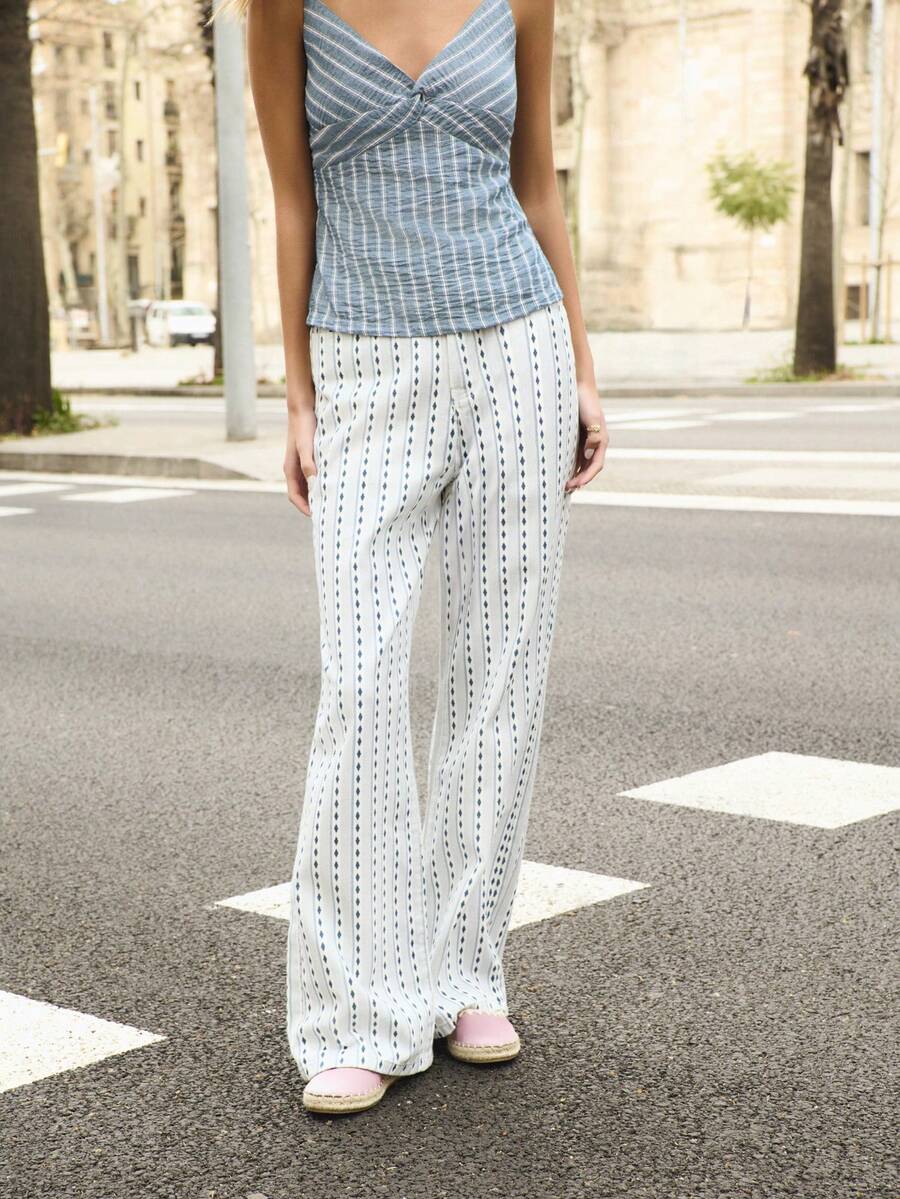 Nöista High-Waisted Denim Pants 4 Pockets, Feature A Vertical Print Stripe Pattern With A Flared Leg Design. Spring, Summer, Easter - Blue - View 1