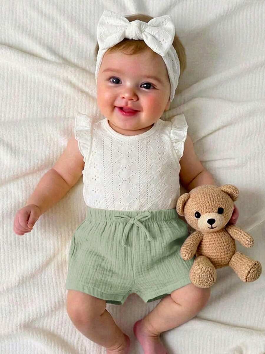 Bộ đồ liền thân mùa hè dễ thương cho bé sơ sinh gồm áo và quần short trắng, có chun co giãn. - Nhiều màu - Xem 1