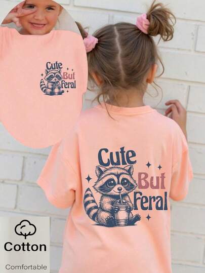 Camiseta de algodón de manga corta con estampado gráfico de lema "CUTE BUT" y diseño de mapache bebiendo té de burbujas, para niña, estilo casual, cómodo y de moda, tops de verano