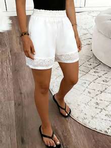 Isle Nomé Pantalones cortos de mujer con cintura con volantes, tejidos y bordados - Blanco - Ver 1